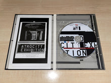 Load image into Gallery viewer, The Atrocity Exhibition DVD Inside
